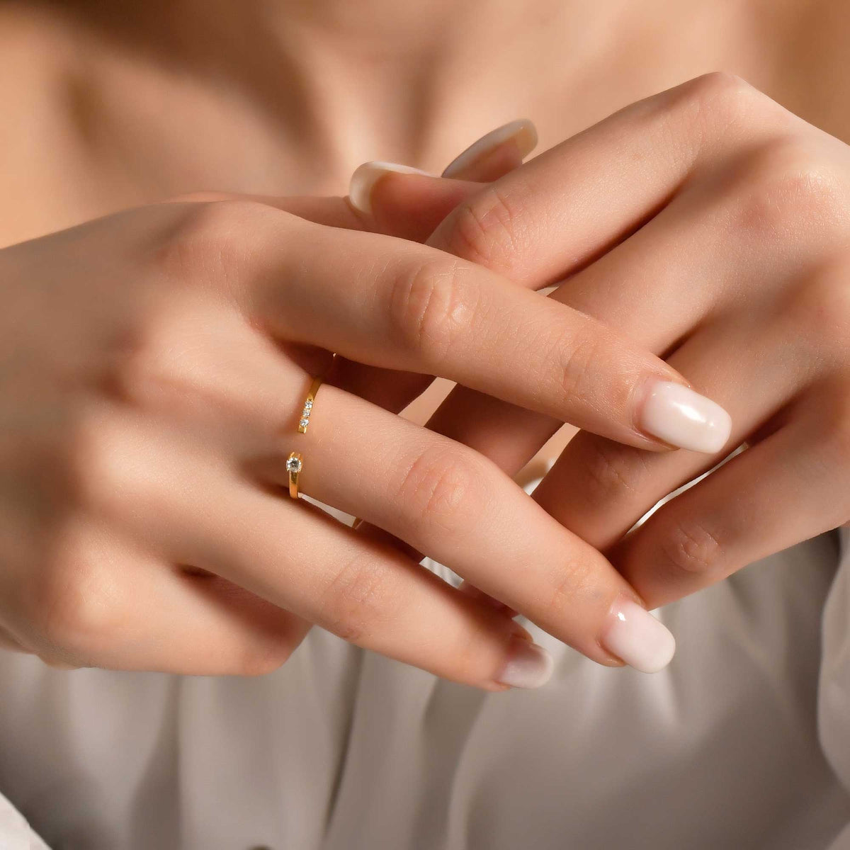 18K gold open cuff diamond ring on finger, close-up