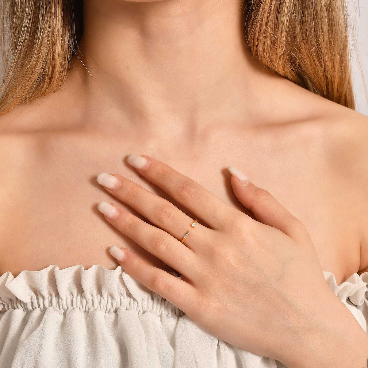 14K gold open cuff cubic zirconia ring worn on hand, side view