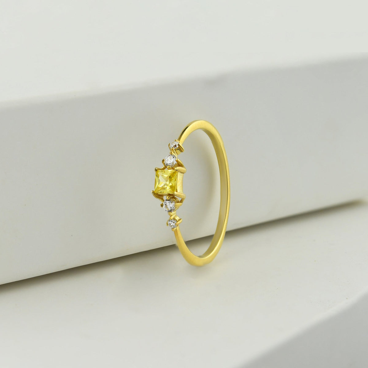 14K gold yellow-stone princess diamond ring on display