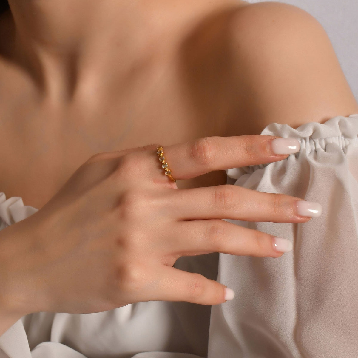 14K gold five baguette bezel diamond ring worn on hand