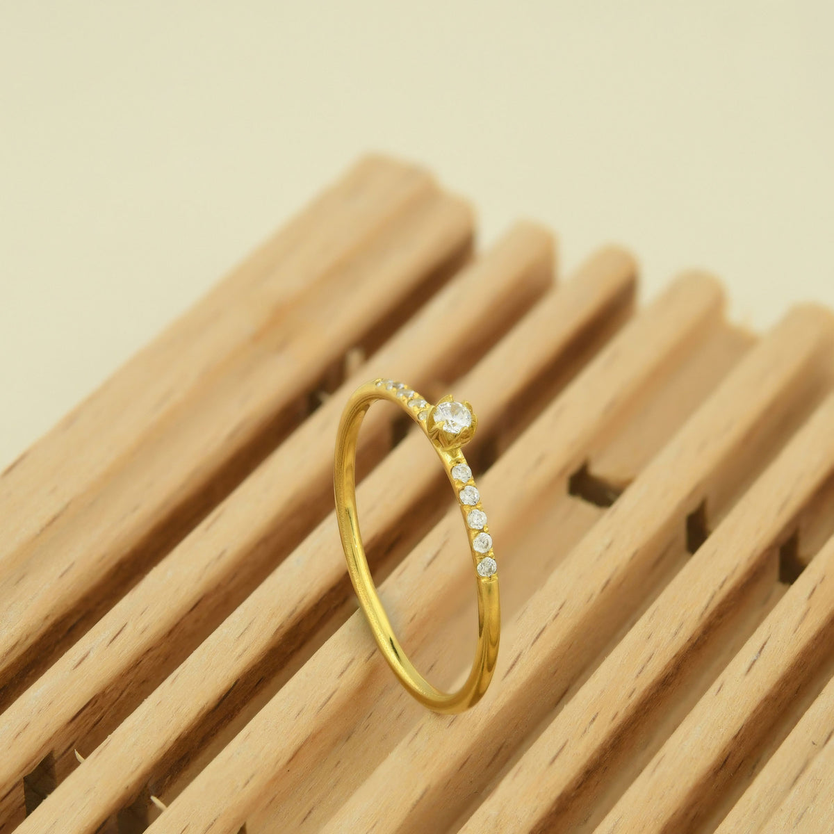 10K gold petal center cubic zirconia ring on display