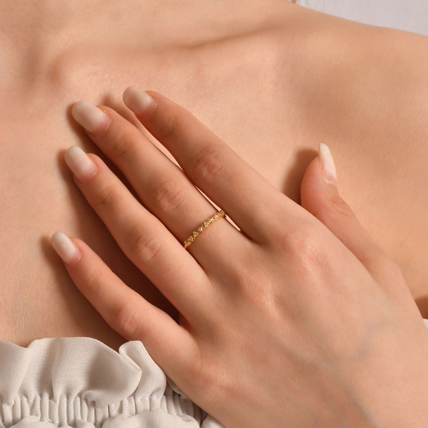 18K gold minimalist heart diamond ring worn on hand