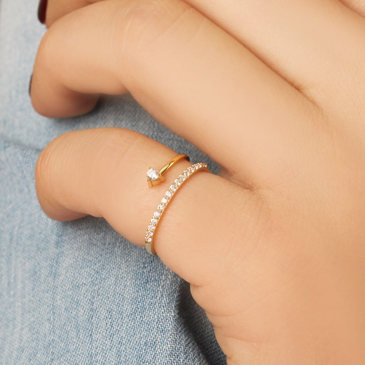 14K gold pave swirl cubic zirconia ring worn on hand, side view