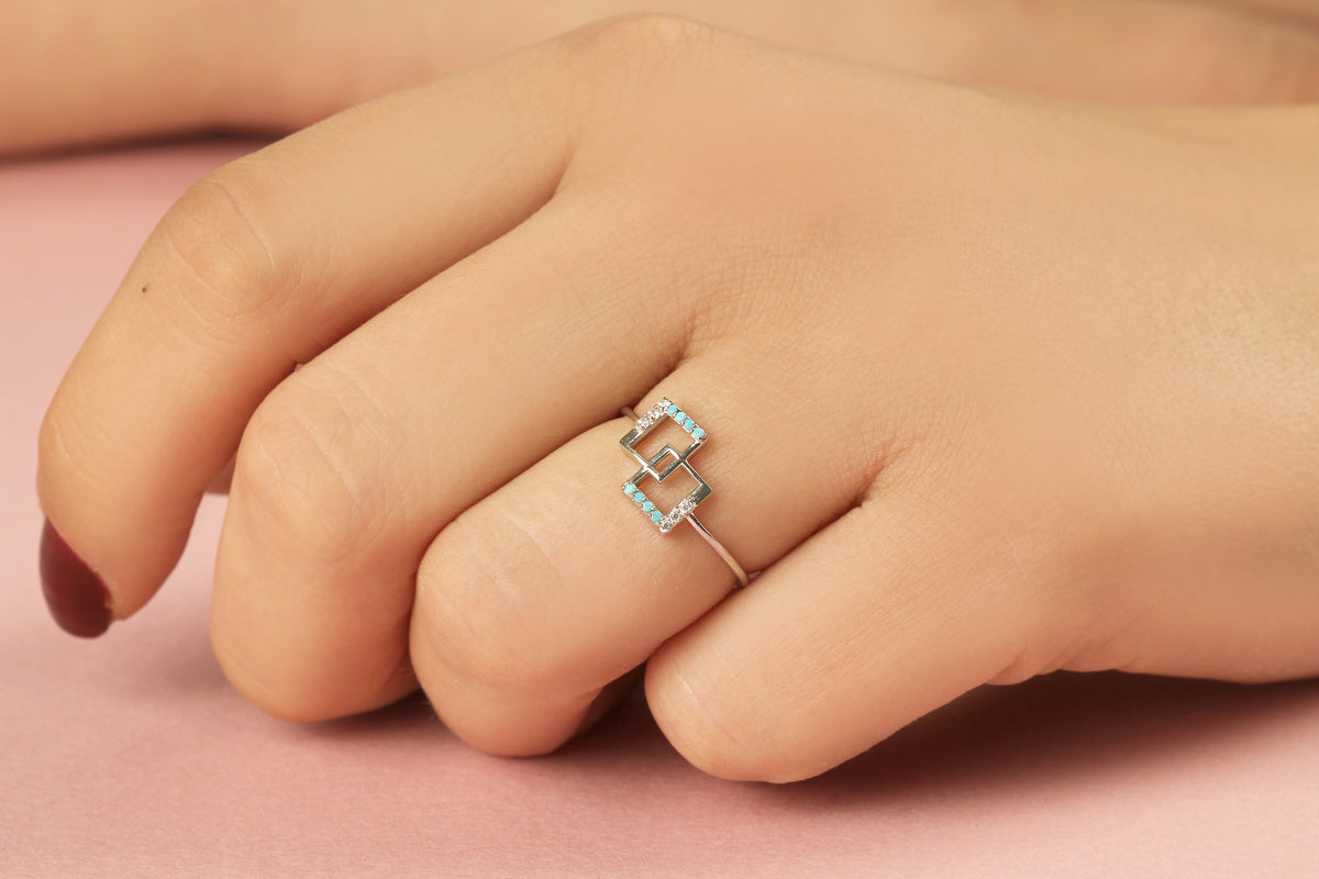 18K gold geometric square ring with turquoise stones and natural diamonds worn on hand, side view