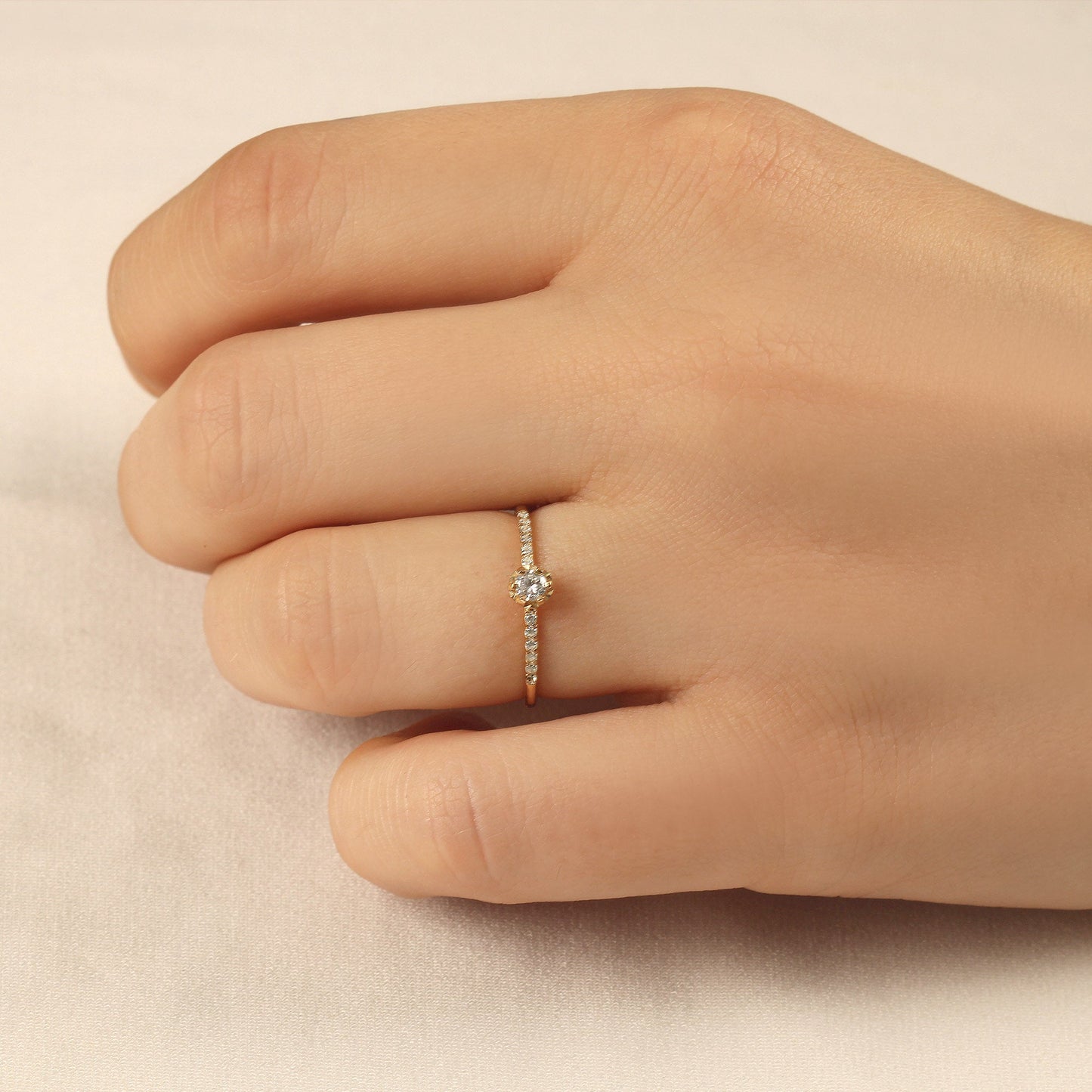 14K gold solitaire engagement cubic zirconia ring worn on hand