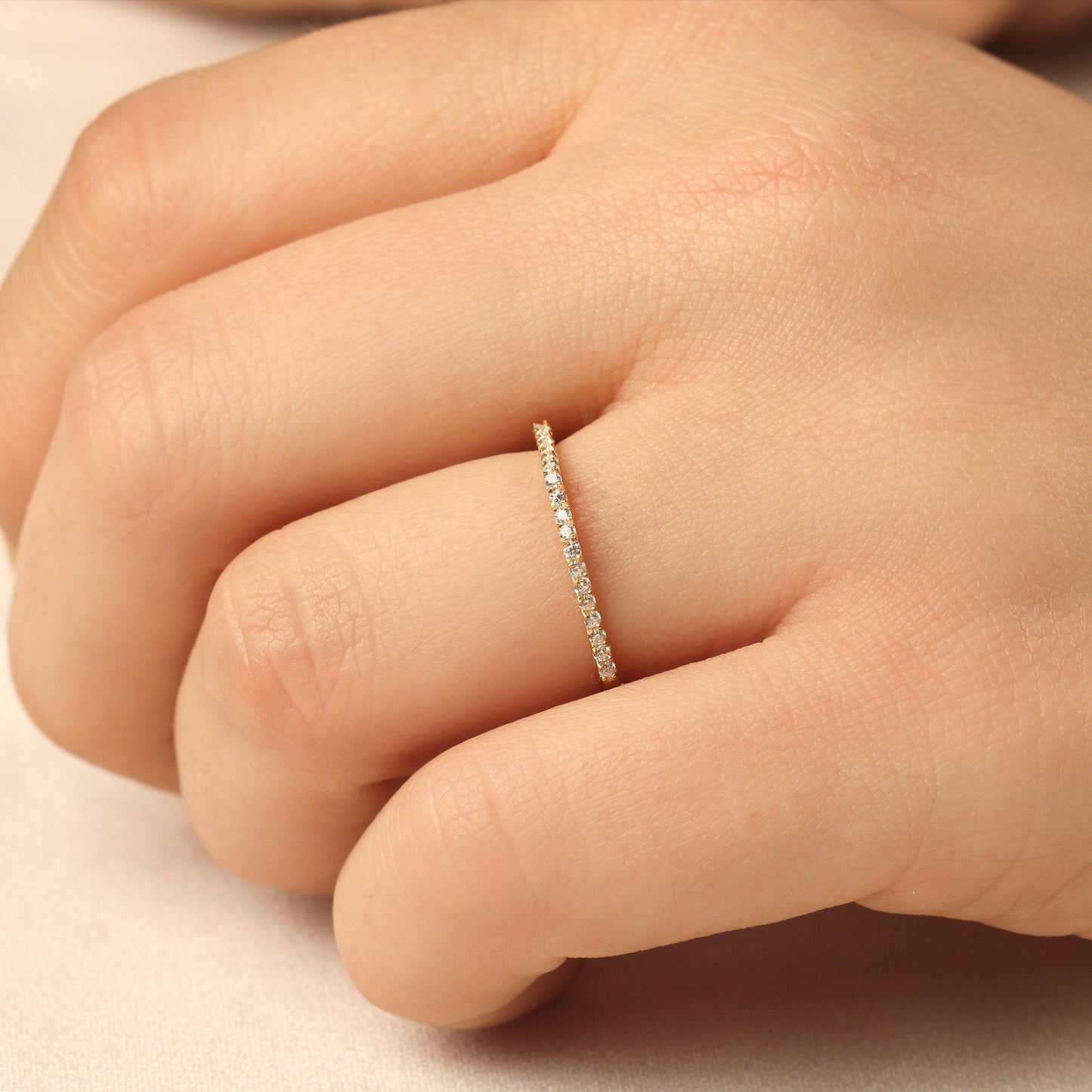 18K gold chevron diamond ring worn on hand